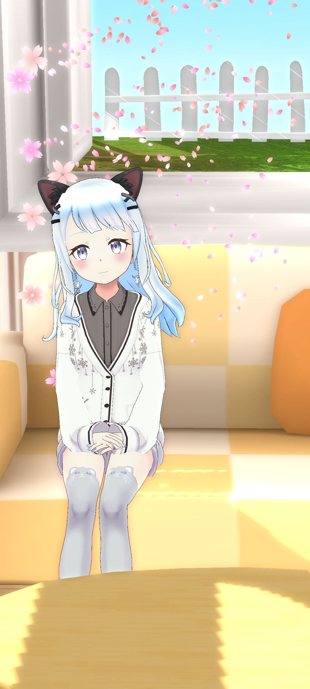桜が舞う中で座る結希さん